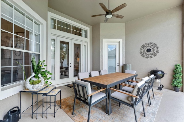 view of patio featuring ceiling fan, a grill, and french doors