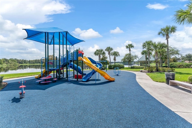 view of playground with a water view