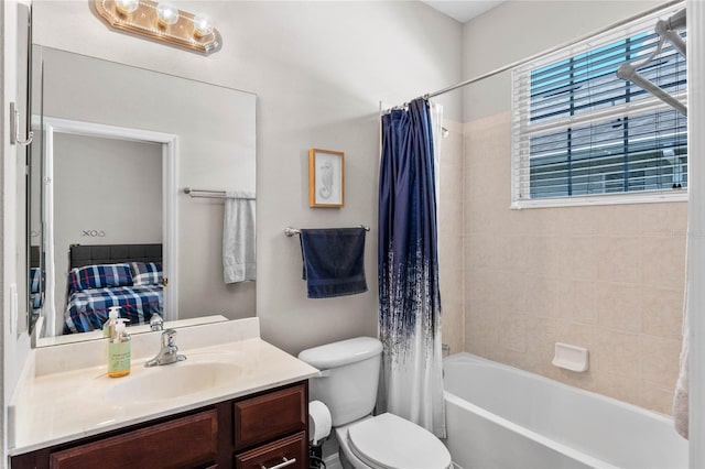 full bathroom featuring shower / bath combo, vanity, and toilet