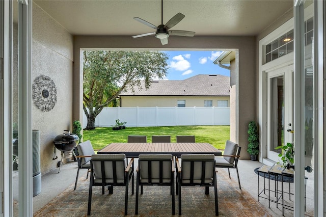 view of patio featuring area for grilling and ceiling fan