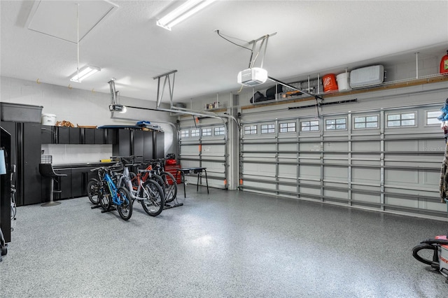 garage featuring a garage door opener