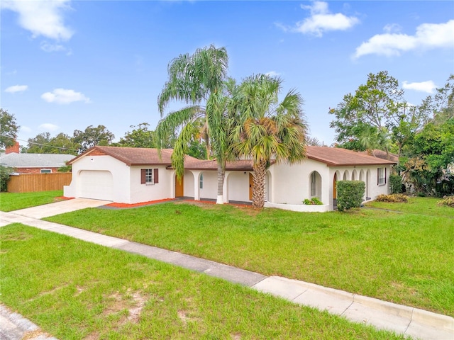 view of front of house with a front lawn and a garage