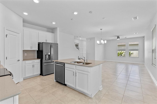 kitchen featuring a kitchen island with sink, sink, white cabinets, appliances with stainless steel finishes, and ceiling fan