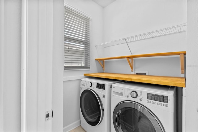 laundry room with independent washer and dryer