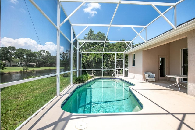 view of pool with a patio area, a yard, a water view, and glass enclosure