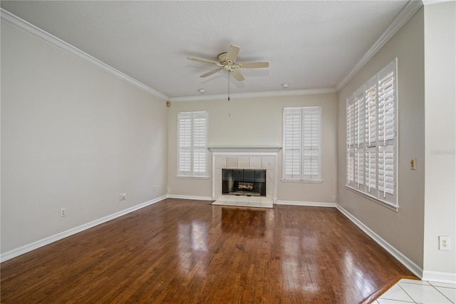 unfurnished living room with hardwood / wood-style flooring, a healthy amount of sunlight, and ceiling fan