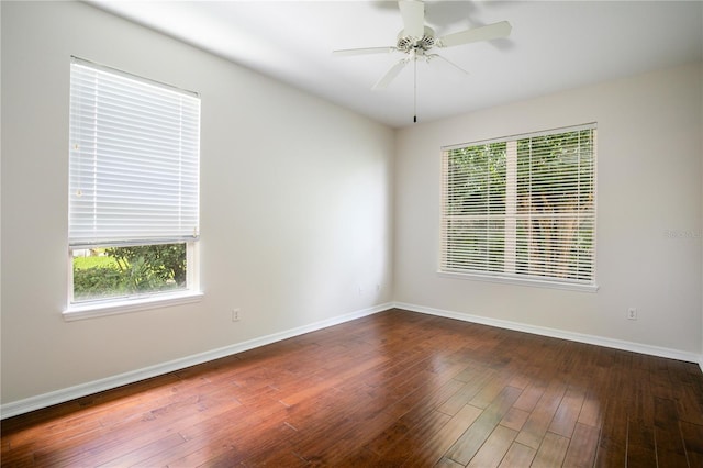 spare room with hardwood / wood-style flooring and ceiling fan