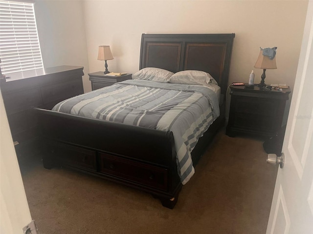 bedroom with dark carpet