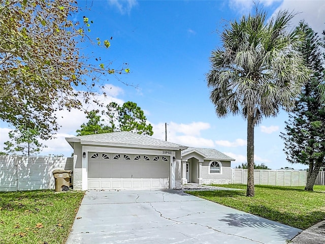 single story home featuring a garage and a front lawn