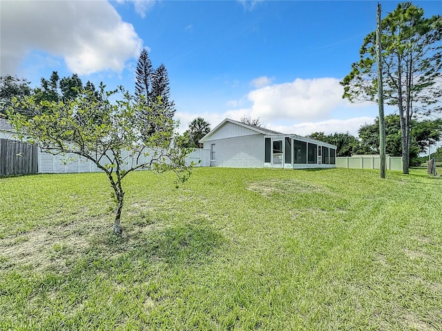 view of yard featuring a sunroom