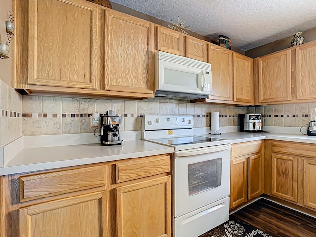 kitchen with a textured ceiling, backsplash, dark hardwood / wood-style flooring, and white appliances