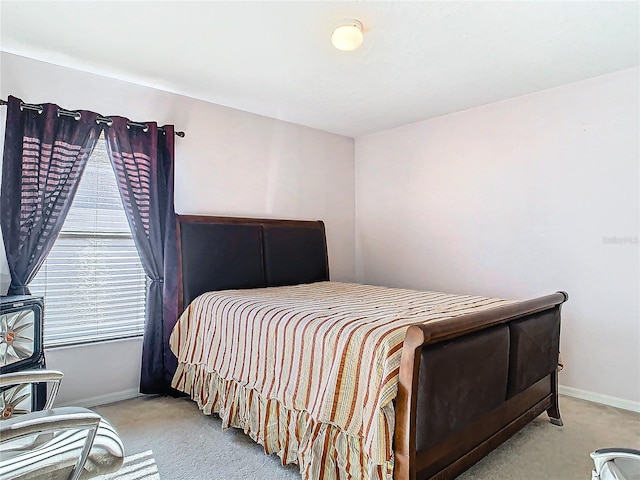 bedroom featuring light colored carpet