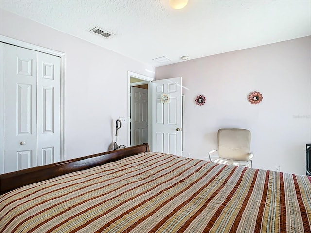 unfurnished bedroom with a closet and a textured ceiling