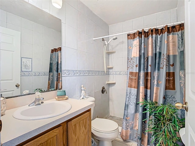 bathroom with tile walls, tile patterned flooring, walk in shower, vanity, and toilet