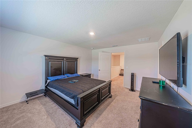 carpeted bedroom with a textured ceiling