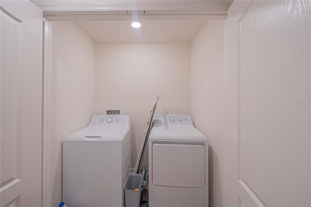 laundry room with washing machine and clothes dryer