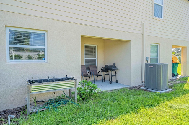 exterior space with cooling unit and grilling area