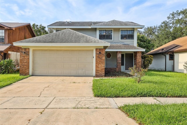 view of front property with a garage and a front yard