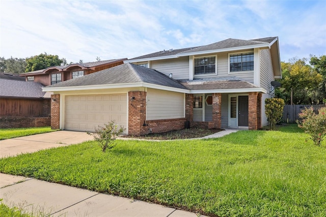 view of front property with a garage and a front lawn