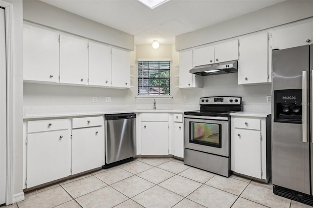 kitchen featuring light tile patterned flooring, white cabinetry, sink, and stainless steel appliances