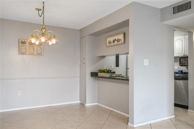 unfurnished dining area with light tile patterned flooring and an inviting chandelier