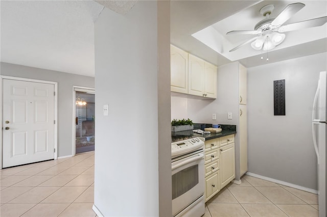 kitchen with ceiling fan, light tile patterned floors, and white appliances