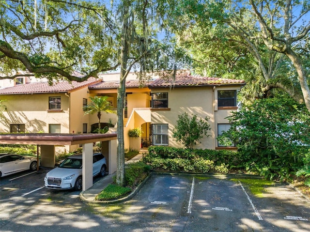 view of front of home with a carport