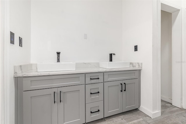 bathroom with wood-type flooring and vanity