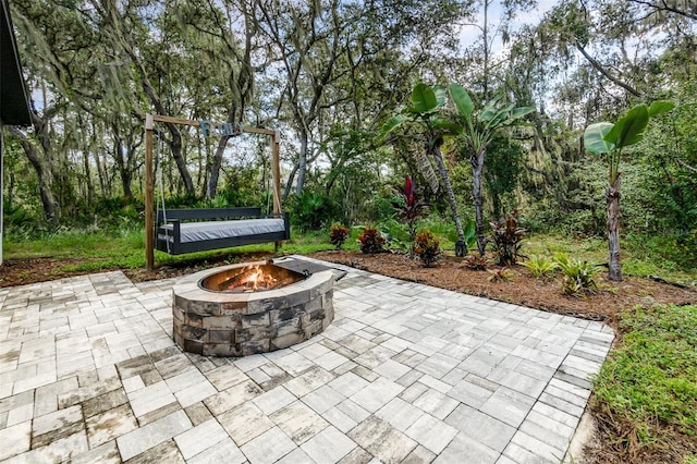 view of patio with an outdoor fire pit