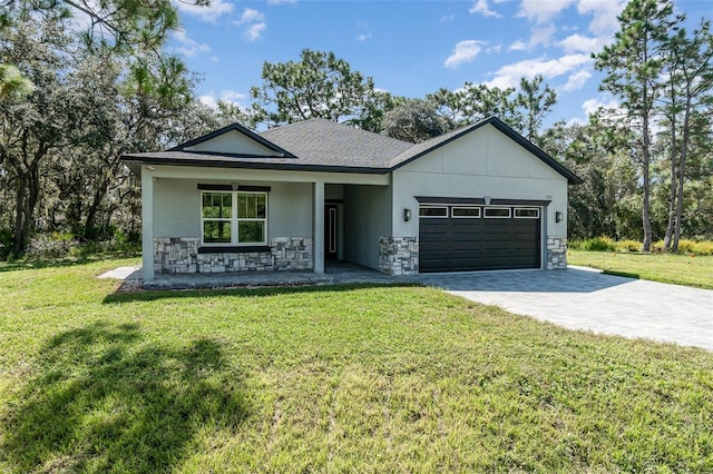 view of front facade with a front lawn and a garage