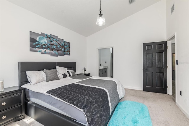 bedroom featuring high vaulted ceiling and light colored carpet