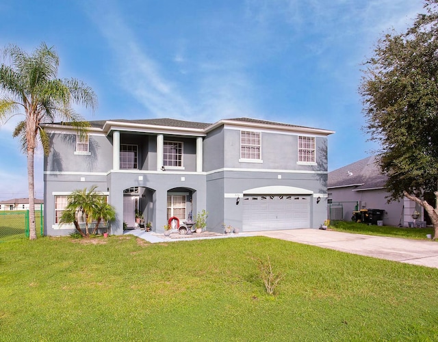 front of property with a garage, a front lawn, and central AC