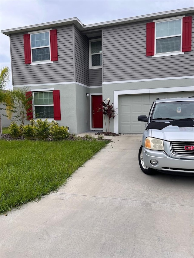 view of front of property with a garage