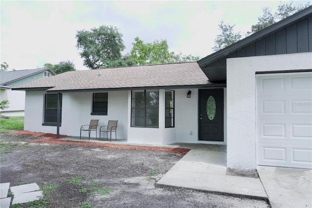 property entrance with a garage