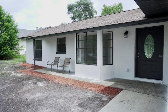 entrance to property with a patio area