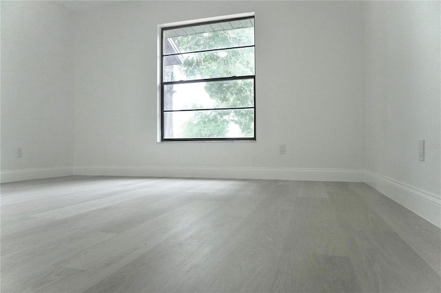 empty room with hardwood / wood-style floors