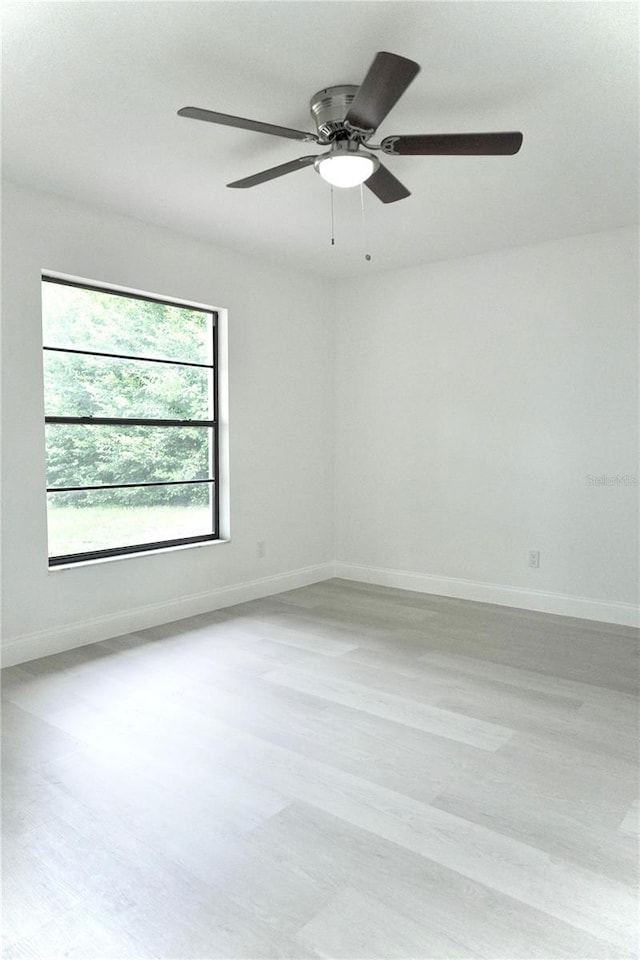 unfurnished room with ceiling fan