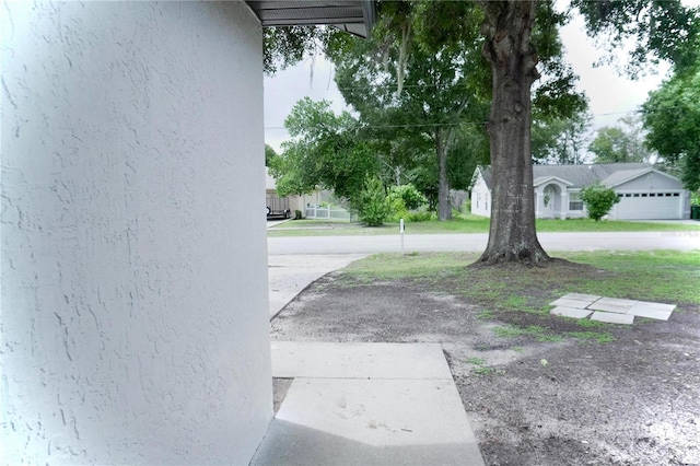 view of yard featuring a garage