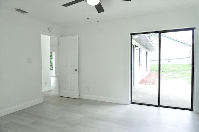 spare room featuring ceiling fan and light hardwood / wood-style floors