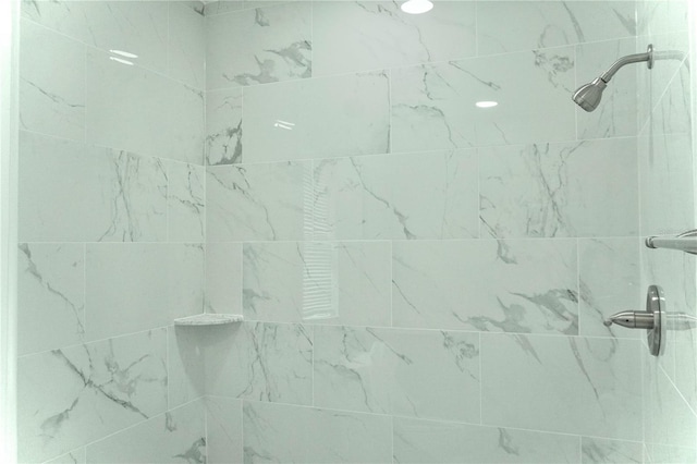 bathroom with tiled shower