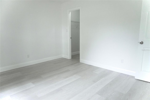 unfurnished room featuring light hardwood / wood-style floors