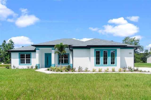 prairie-style house with a front lawn