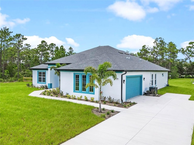 view of front of property featuring a front lawn and a garage