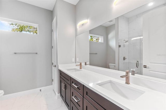 bathroom with walk in shower, vanity, and toilet