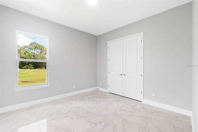 unfurnished bedroom with a closet