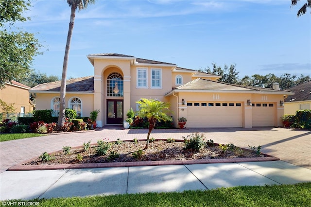 view of front facade featuring a garage and french doors