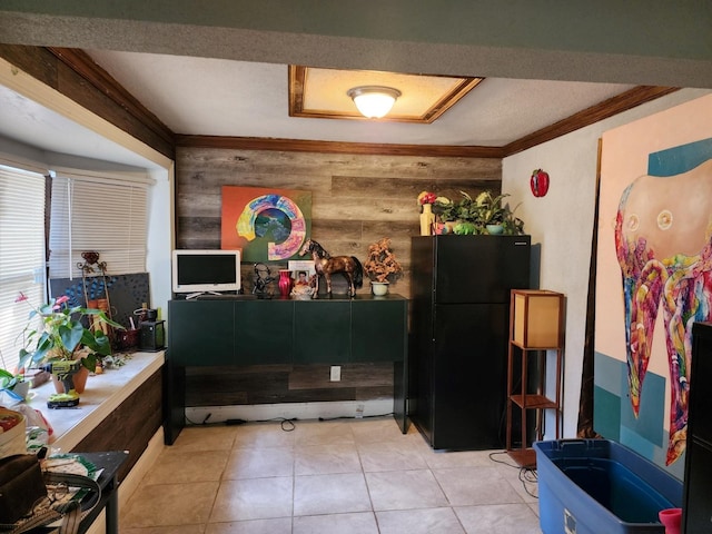 interior space featuring crown molding, wood walls, and tile patterned floors