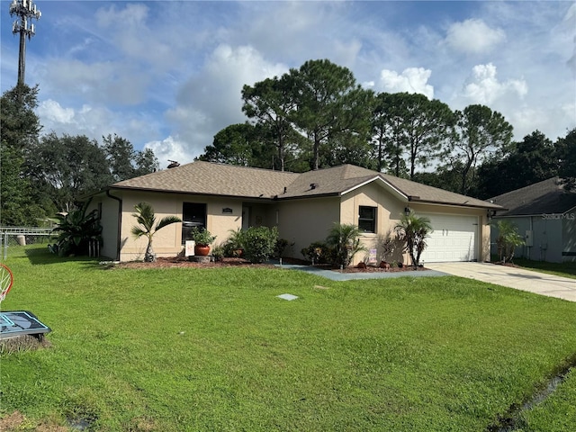 ranch-style house featuring a front yard and a garage