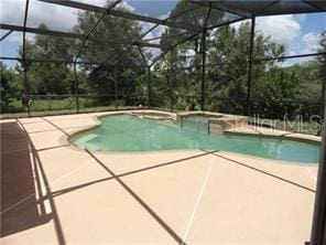 view of pool featuring a lanai and a patio area