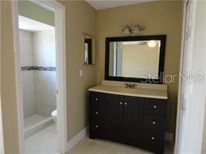 bathroom with tile patterned floors, vanity, and toilet